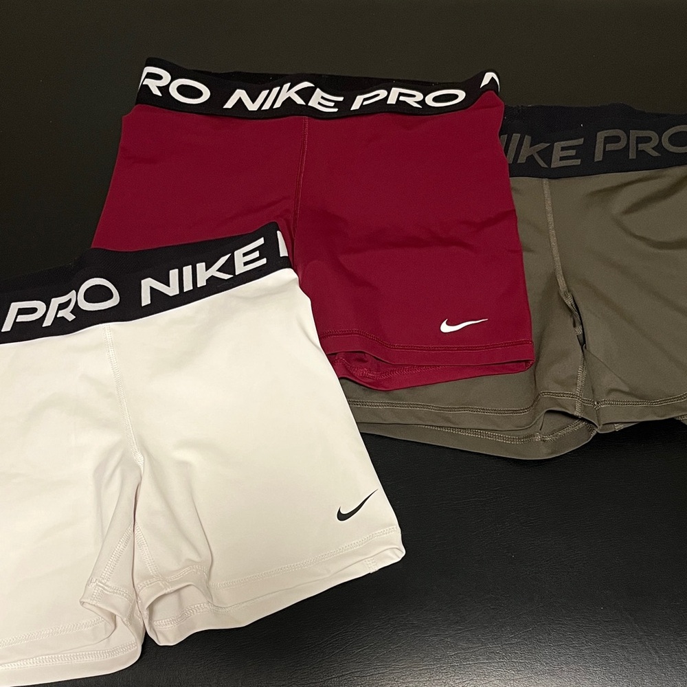 Nike women’s Pro Shorts - burgundy, White, and olive medium m 5inch